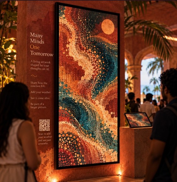 The live art wall at the Conclave: a tall screen of swirling dotted colour titled Many Minds, One Tomorrow, with a QR code to add your thoughts